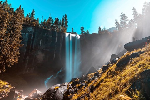 First rays of dawn at Vernal Falls of Yosemite National Park. California