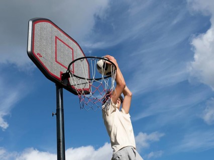 Basketball Jump with the ball to the basket and net