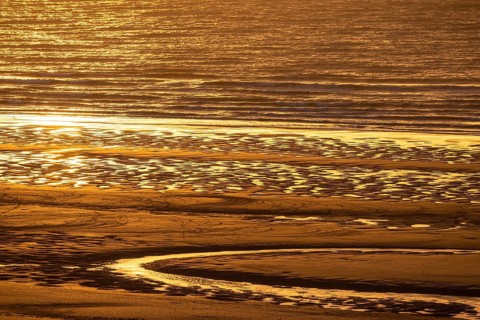 Sunset on the beach of De Panne