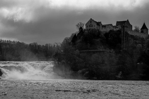 Rhine Falls and Swiss Flag with the Castle Laufen at Neuhausen in Schaffhausen