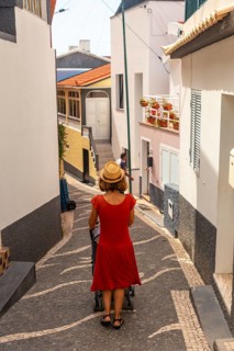 A tourist walking in summer in the town of Paul do Mar in the east of Madeira. Portugal