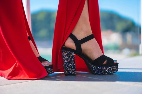 Detail of high-heeled shoes decorated with pearls