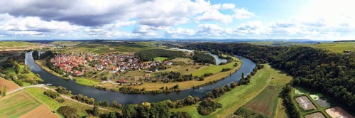 The Mainschleife near Volkach winds through the valley and is surrounded by fields and vineyards. Volkach