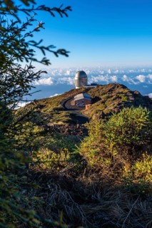 Observatories of the Roque de los Muchachos in the Caldera de Taburiente with a sea of nuts below one summer afternoon