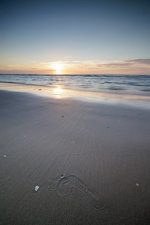 Sunset on the beach of De Panne