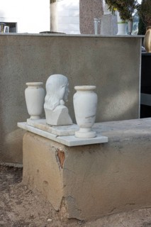 Simple grave with crumbling plaster