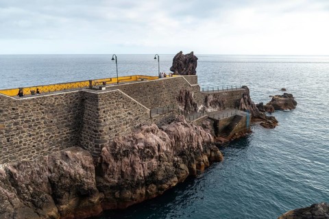 Coast of Ponta do Sol in summer and a marine promenade called Cais da