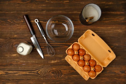 Top view of kitchen table with ingredients for scrambled egg