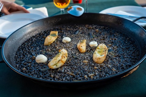Black rice with cuttlefish and young garlic