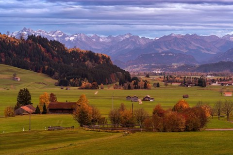 Landscape in the Allgaeu in autumn near Rettenberg with a view of farms