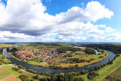 The Mainschleife near Volkach winds through the valley and is surrounded by fields and vineyards. Volkach