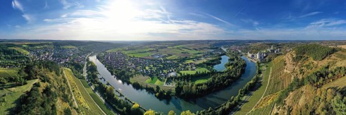 The river loop near Homburg am Main winds through the valley and is surrounded by trees and vineyards. Homburg