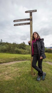 A young woman at the 54 km Thorsmoerk signal of the 4-day trek to Landmannalaugar. Iceland