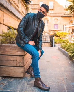 Trendy lifestyle of a Latino guy in the city. Jeans