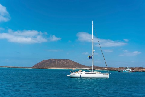 Boats in turquoise water on Isla de Lobos