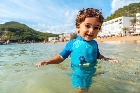 One year old boy bathing in the sea