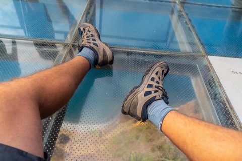Looking at the glass floor at the highest viewpoint called Cabo Girao in Funchal. Madeira