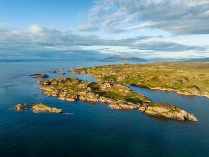 Aerial view of the coastline of the Ross of Mull peninsula with small islands