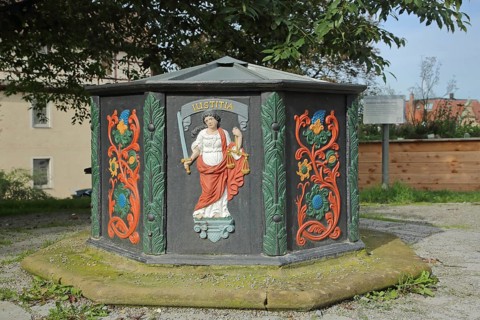 Abbey fountain built 1713 with relief and inscription