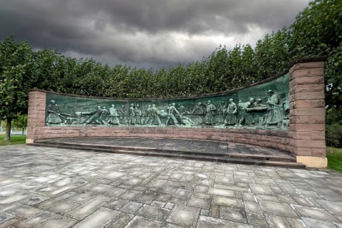 Dark clouds over crucible casting monument Monument for production of steel crucible steel in the form of panorama semicircle by sculptor Artur Hoffmann from 1952 for steel workers of Krupp Stahlwerke...