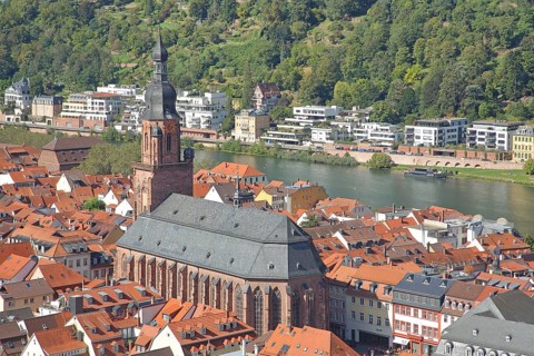 View from above of Gothic Heiliggeistkirche with cityscape and Neckar river