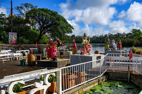 View of several Hindu deities at religious site largest Hindu sanctuary sanctuary for religion Hinduism outside India for devout Hindu Hindus Saint lake crater lake Grand Bassin Ganga Talao