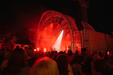 Crowd at Live Klostersommer Festival in Historic Monastery