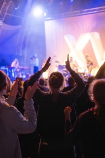 Cheering crowd at Live Klostersommer Festival in Historic Monastery