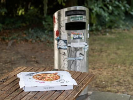 Pizza box on a parking table