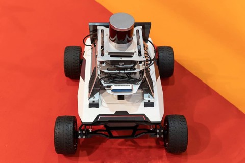 Driverless electric self-driving robot at the expo. Mid shot