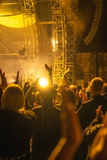 Cheering crowd at Live Klostersommer Festival in Historic Monastery