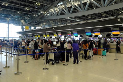 Passengers at the Singapore Airline counter