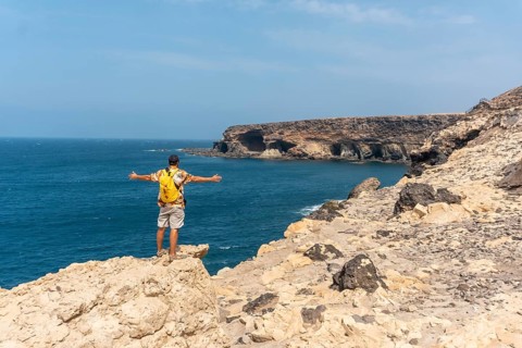 A young tourist on the trail heading to the caves of Ajuy