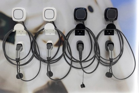 Charging handles and cables at the electric charging station. Mid shot