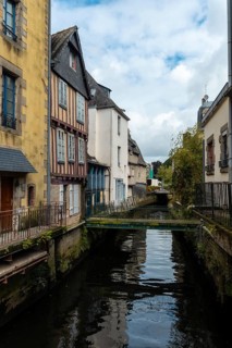 Traditional wooden houses by the river in the medieval town of Quimper in the department of Finisterre. French Brittany