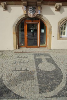 City coat of arms as floor mosaic in front of the historic town hall