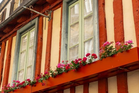 Old wooden colored houses in the medieval village of Quimper in the Finisterre department. French Brittany