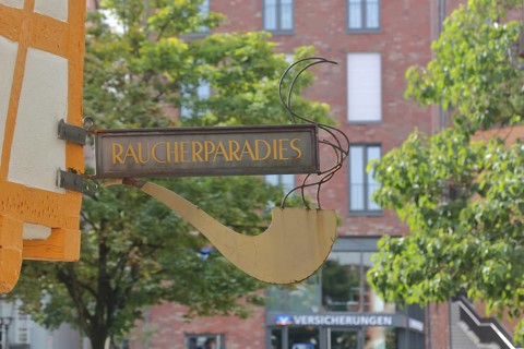 Nose sign with inscription smoker's paradise and insurance