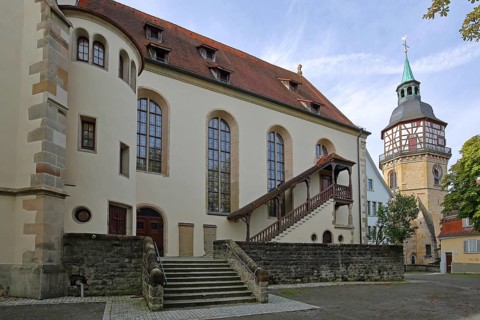 Late Gothic collegiate church of St. Pancratius with exterior staircase and historic town tower landmark