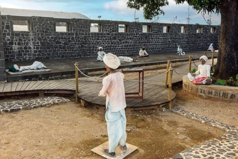 View of grounds Exterior open space of present day slave museum Museum of slavery historical arrival site for housing detention camp internment of captive slaves with figures depicting slaves show