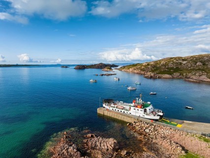 Aerial view of the Fionnphort ferry terminal with the ferry MV Loch Buie of the shipping company Caledonian MacBrayne operating a scheduled service between Fionnphort and the Isle of Iona