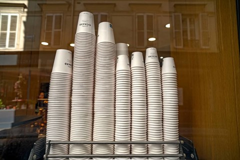 Stacked paper cups for coffee to go in a cafe