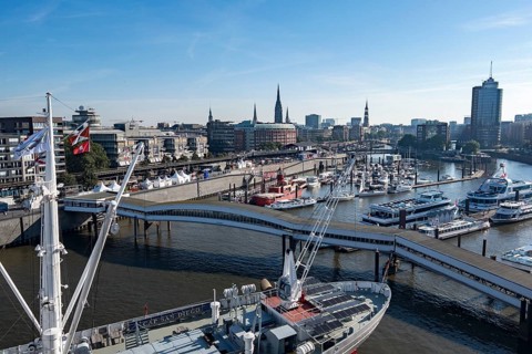 View of Niederhafen harbour and the museum ship Cap San Diego at the Ueberseebruecke bridge in the Port of Hamburg from a cruise ship