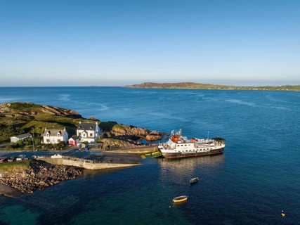 Aerial view of the Fionnphort ferry terminal with the ferry MV Loch Buidhe of the shipping company Caledonian MacBrayne operating a scheduled service between Fionnphort and the Isle of Iona