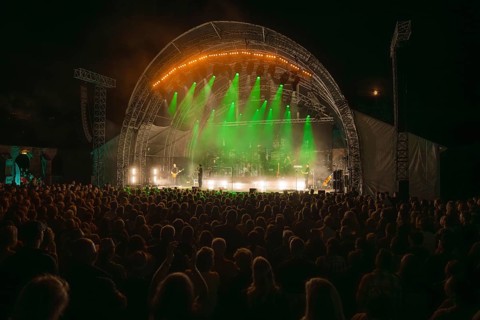 Crowd at Live Klostersommer Festival in Historic Monastery in front of stage