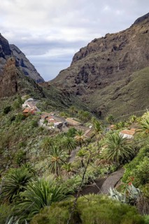 View over the small picturesque mountain village Masca among black volcanic cliffs in the Macizo de Teno mountains on Tenerife