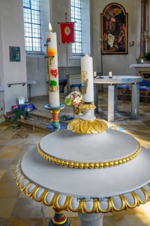 Baptismal font with candles