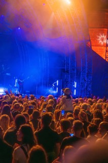 Crowd at Live Klostersommer Festival in Historic Monastery in front of stage