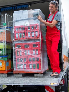 Man on loading ramp truck