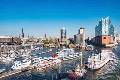 View from a cruise ship of harbour cruise ships and the Niederhafen at the Ueberseebruecke of the Port of Hamburg